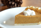 Slice of pumpkin pie on a white plate on a wooden table. Gratitude for Wellness. As we approach another Thanksgiving, we want to take a moment to reflect on the past year and all the changes that came with it.